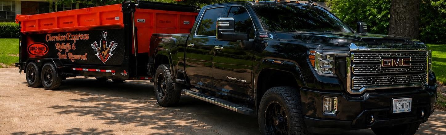 The Cherokee Express rig: GMC Denali HD and branded 17-yard rolloff trailer