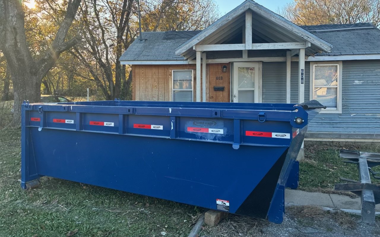 Rolloff dumpster placed at a residential driveway